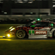 Porsche GTD at Rolex 24 in 2020. Notice the yellow-green lighting and the green #1 in the window for GTD.